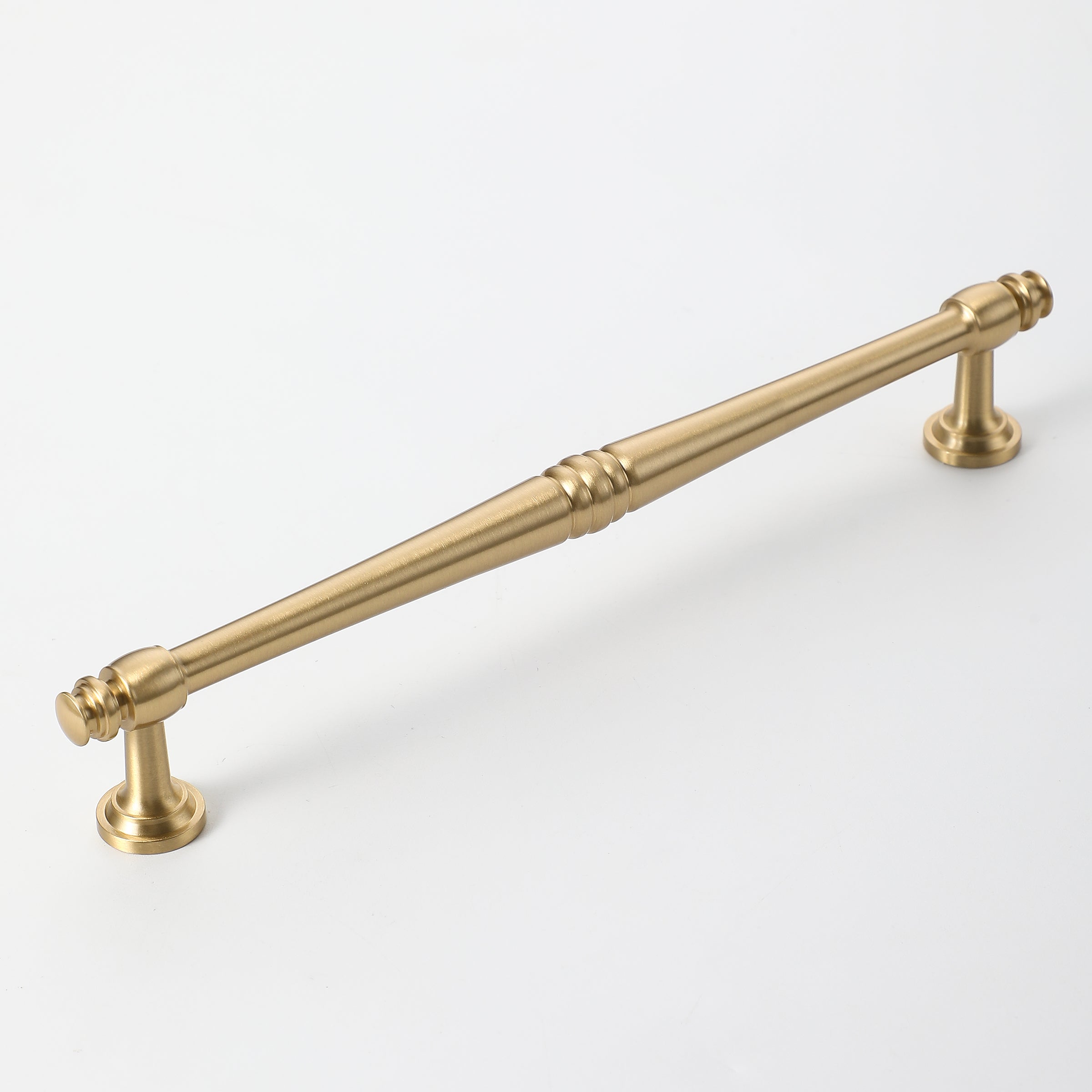 Extra-long brushed gold kitchen cabinet handle with spindle detailing.