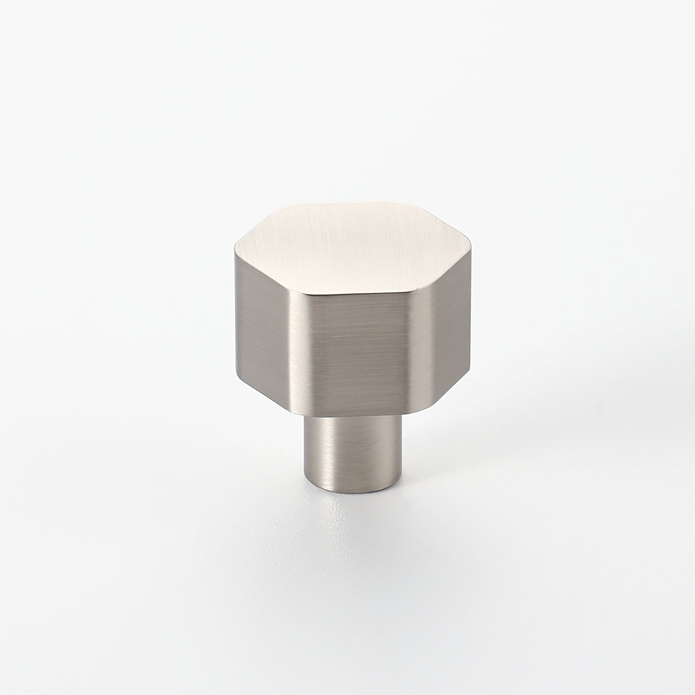 Modern hexagon-shaped cabinet knob in brushed nickel finish, made from solid brass.