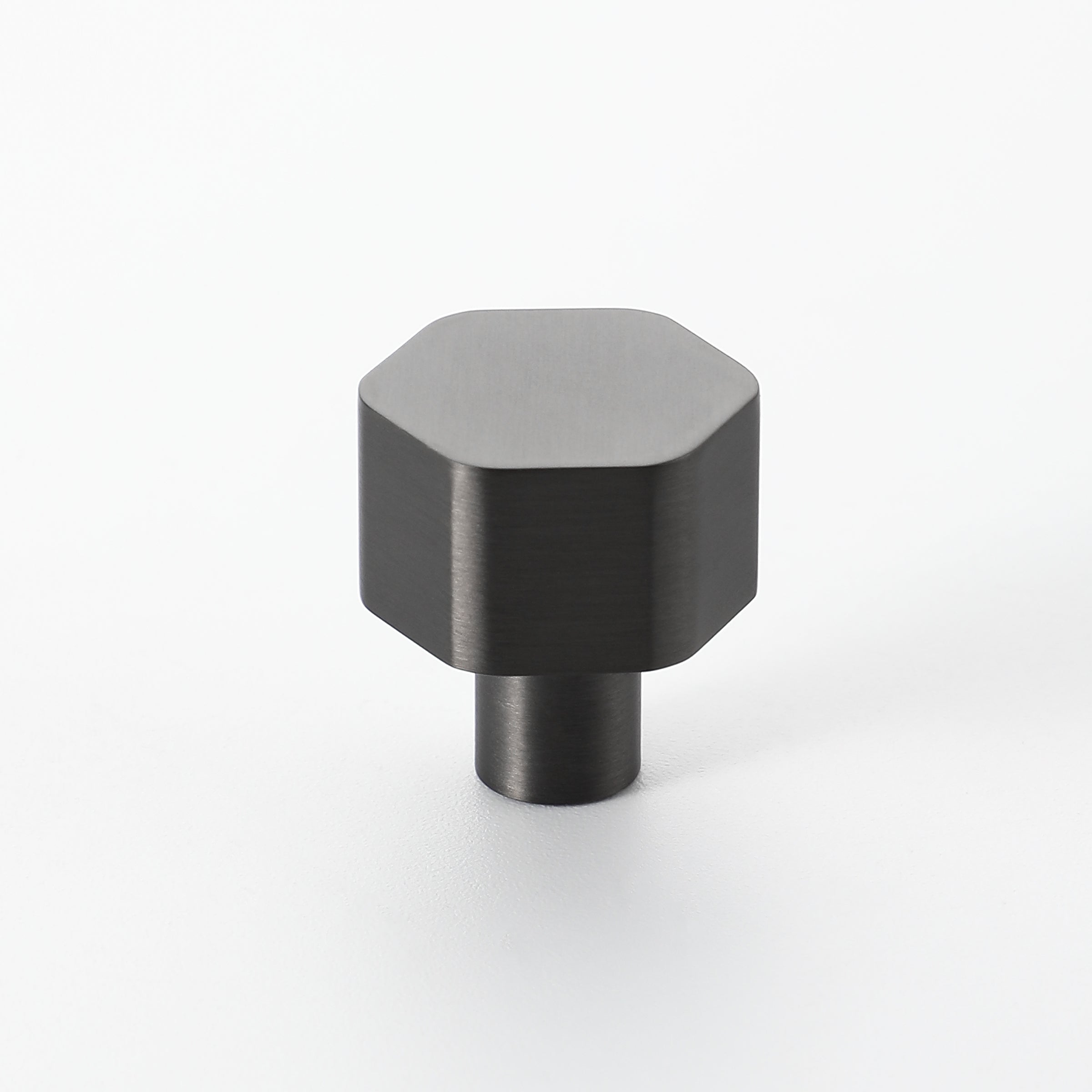 Gunmetal finish Hexon brass knob with clean geometric edges, suitable for contemporary cabinets.