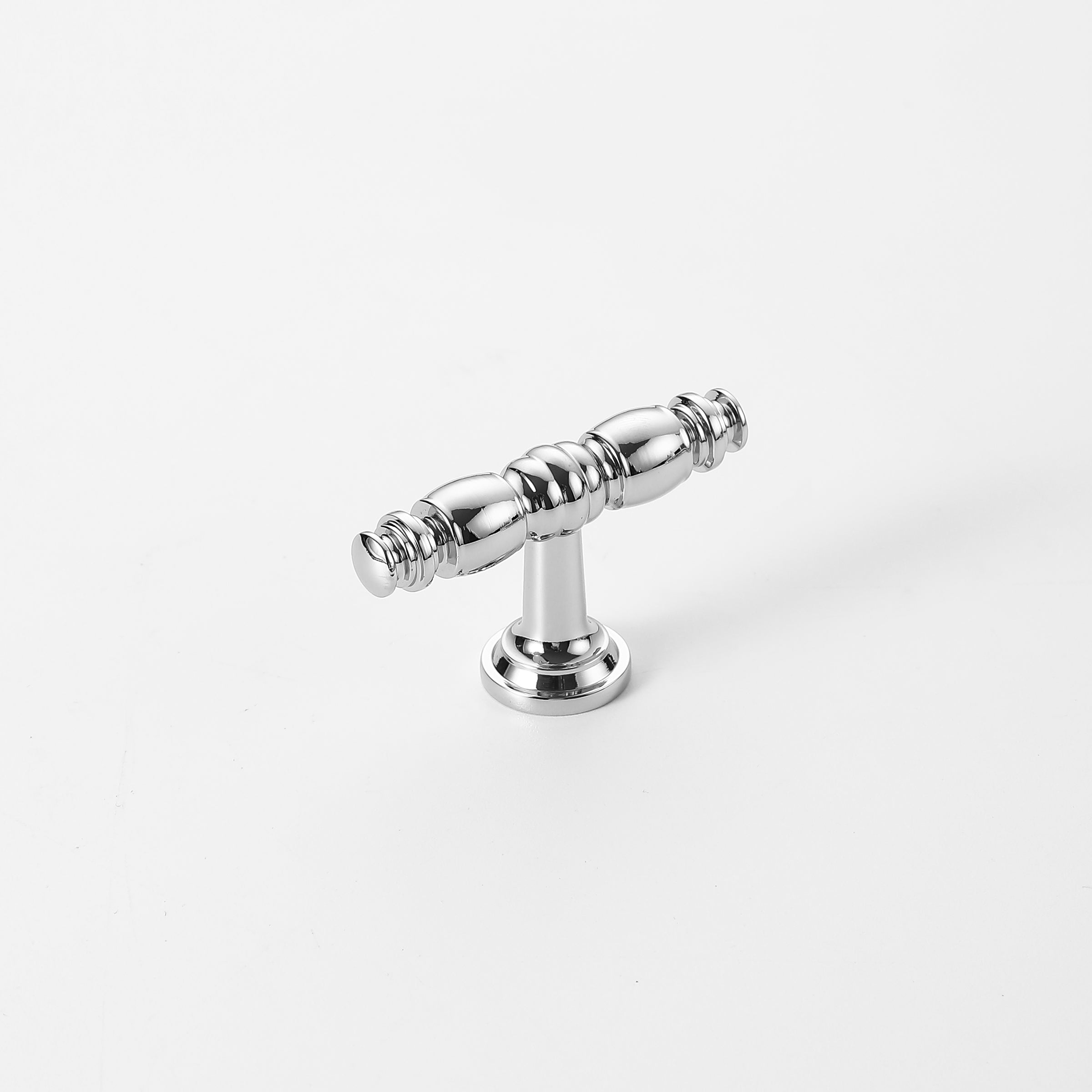 Polished chrome cabinet knob with classic spindle design and smooth finish.