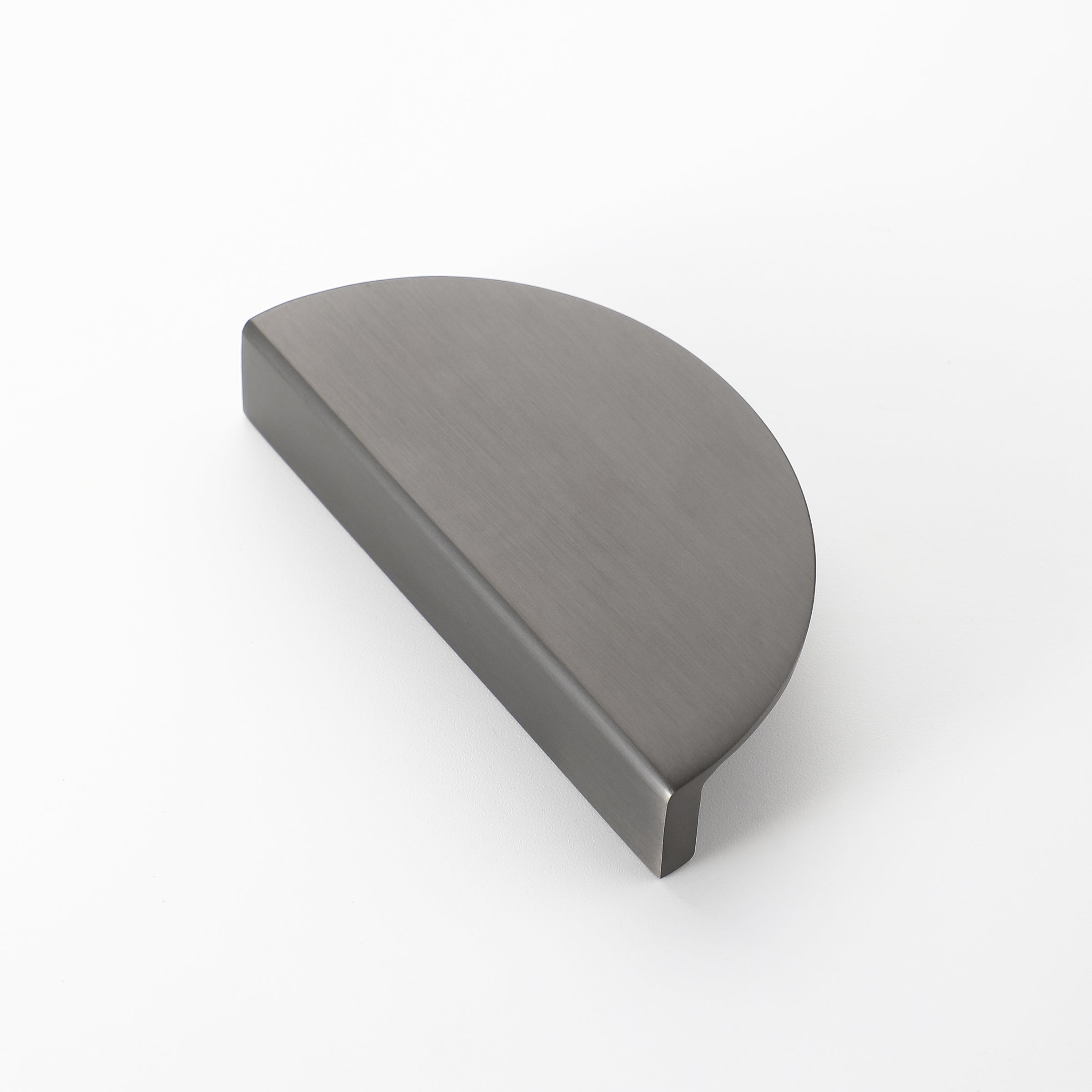 Half moon drawer pull in matte black finish with brushed texture, modern cabinet handle design.