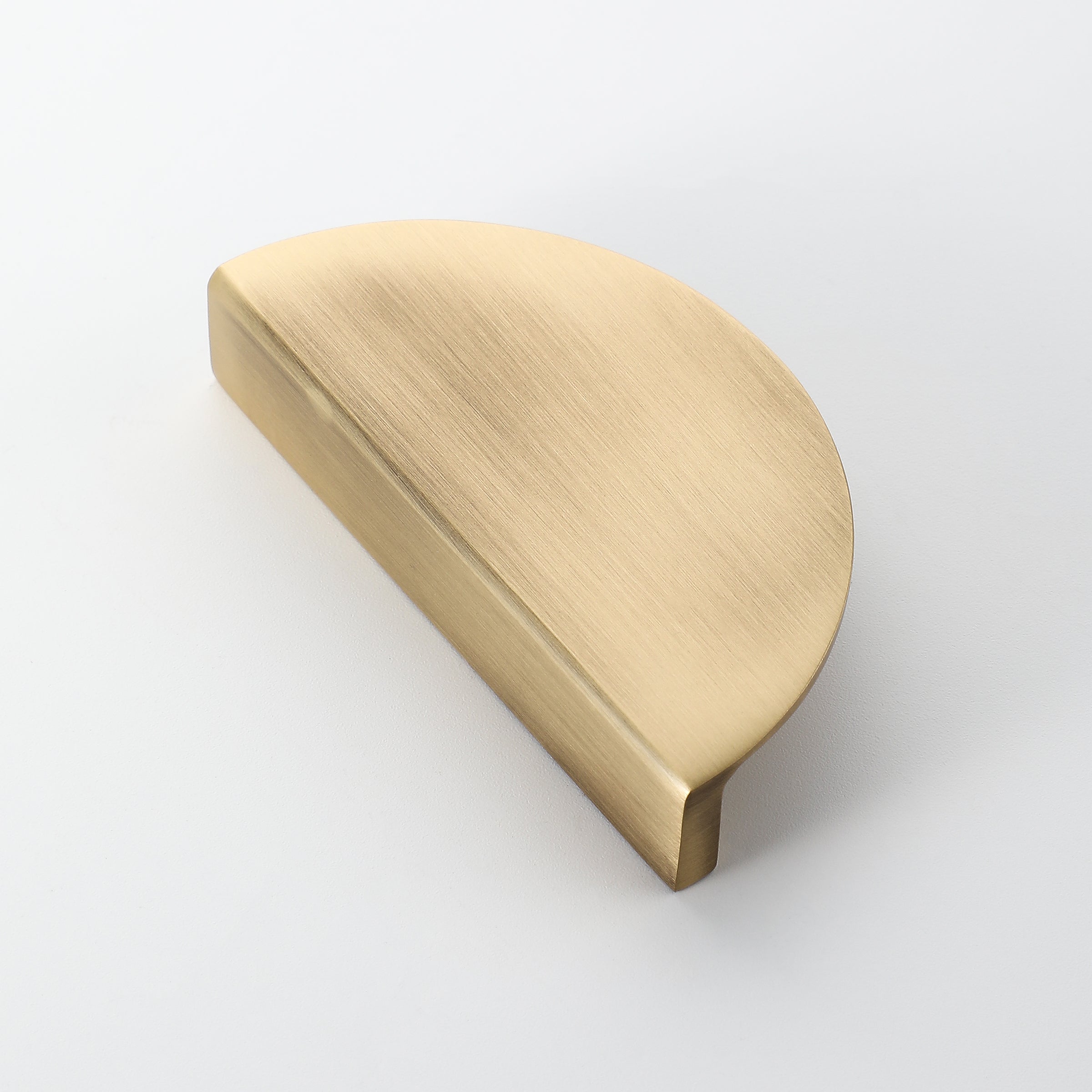 Solid brass half moon drawer handle with aged brushed finish, ideal for cabinets and dressers.
