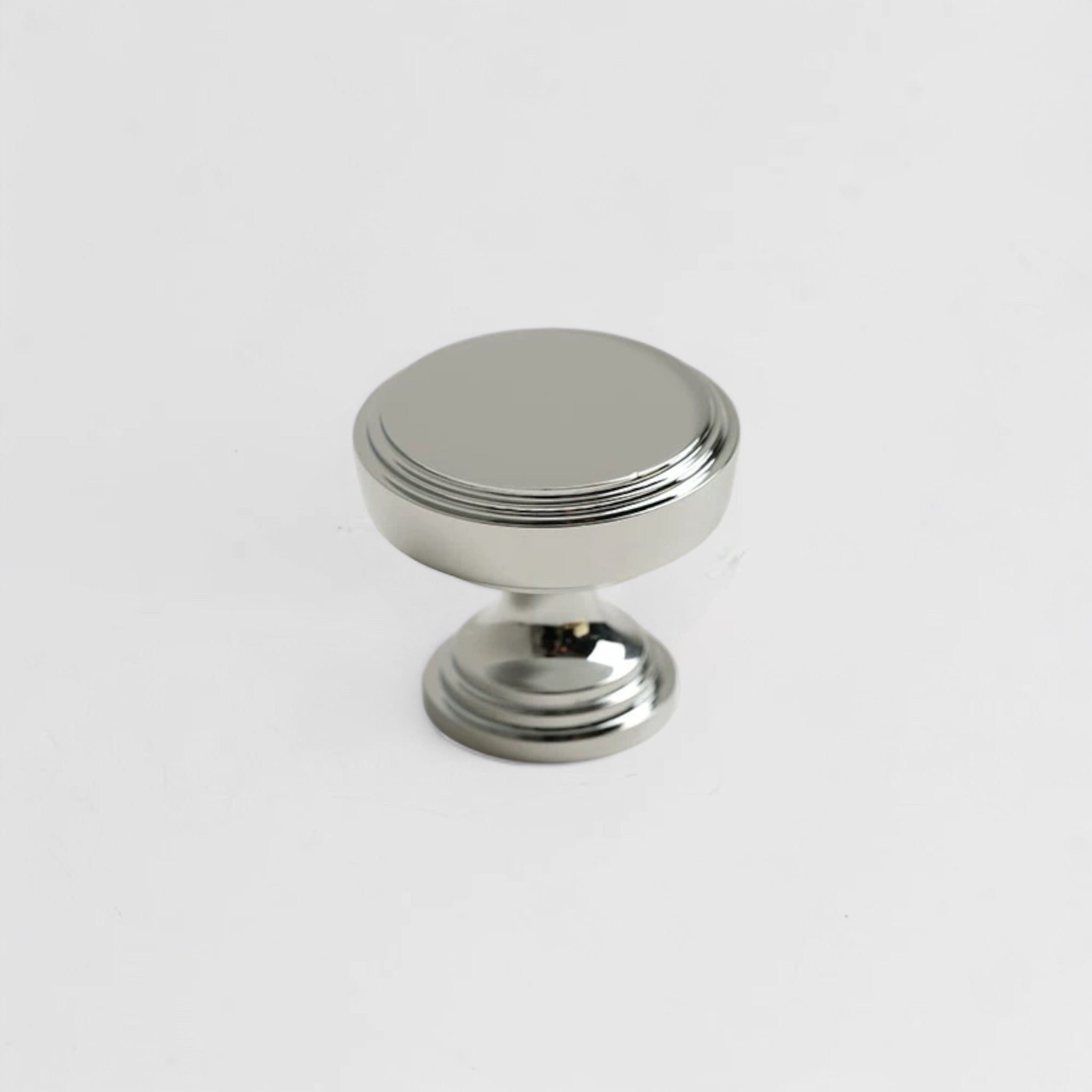 Polished nickel drawer knob with a contemporary design, crafted for kitchen and wardrobe use