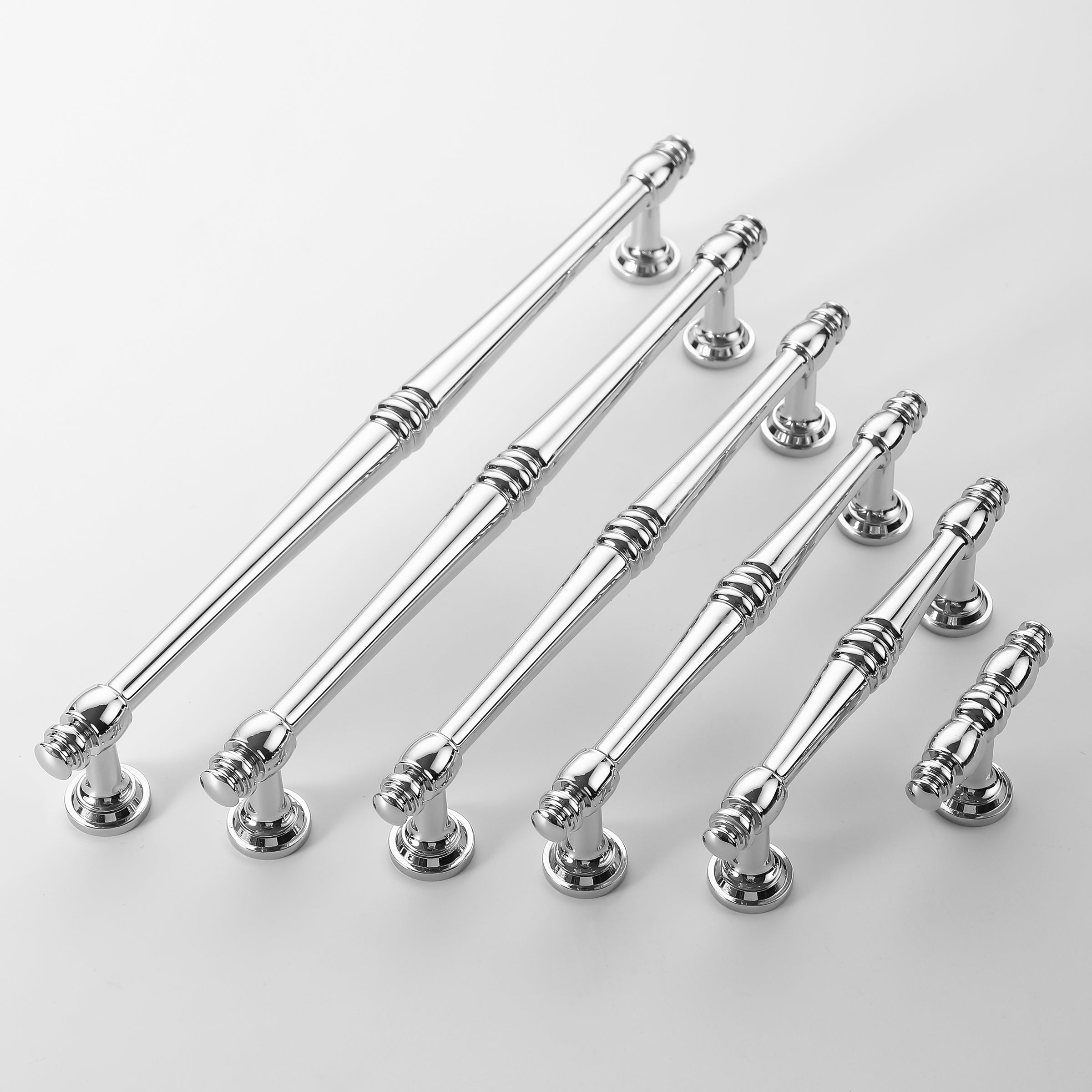 Collection of polished chrome cabinet pull handles with spindle design in different sizes.