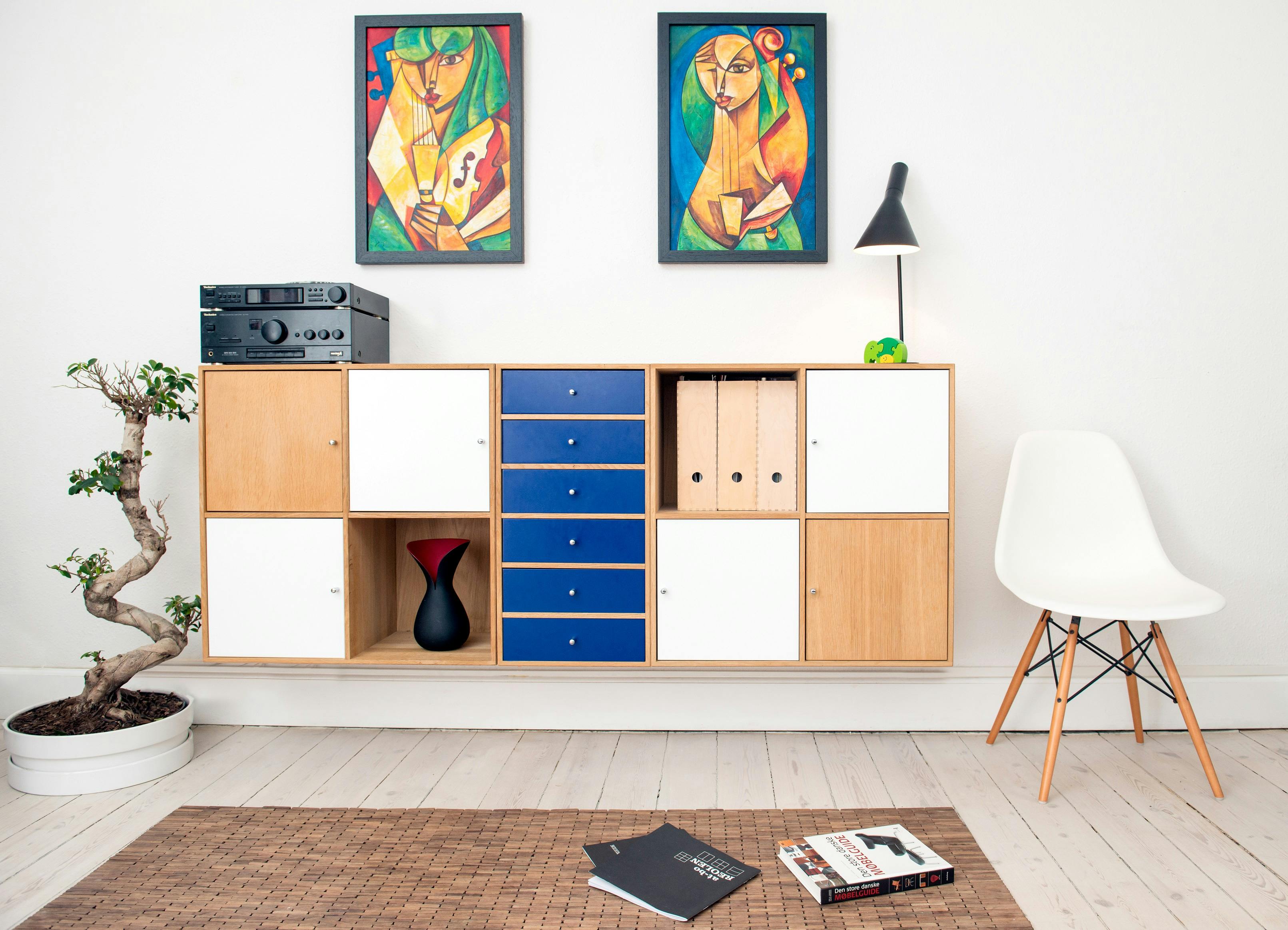 a wooden cabinet with blue drawers