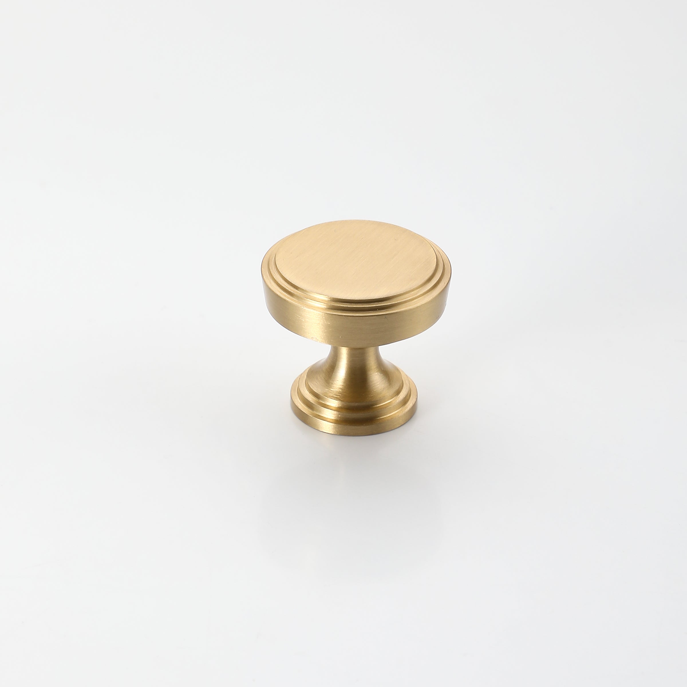 Brass drawer knob with a sleek brushed surface, perfect for kitchen cabinets and drawers.